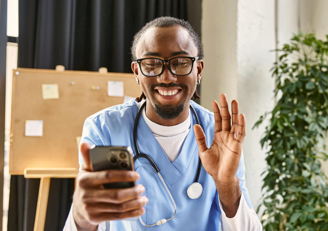 health-provider-smiling-virtual-consultation health-provider-smiling-virtual-consultation